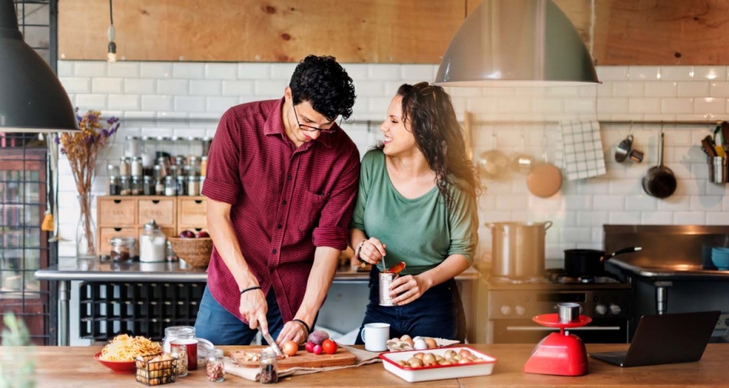 A couple cooking in the kitchen of their home