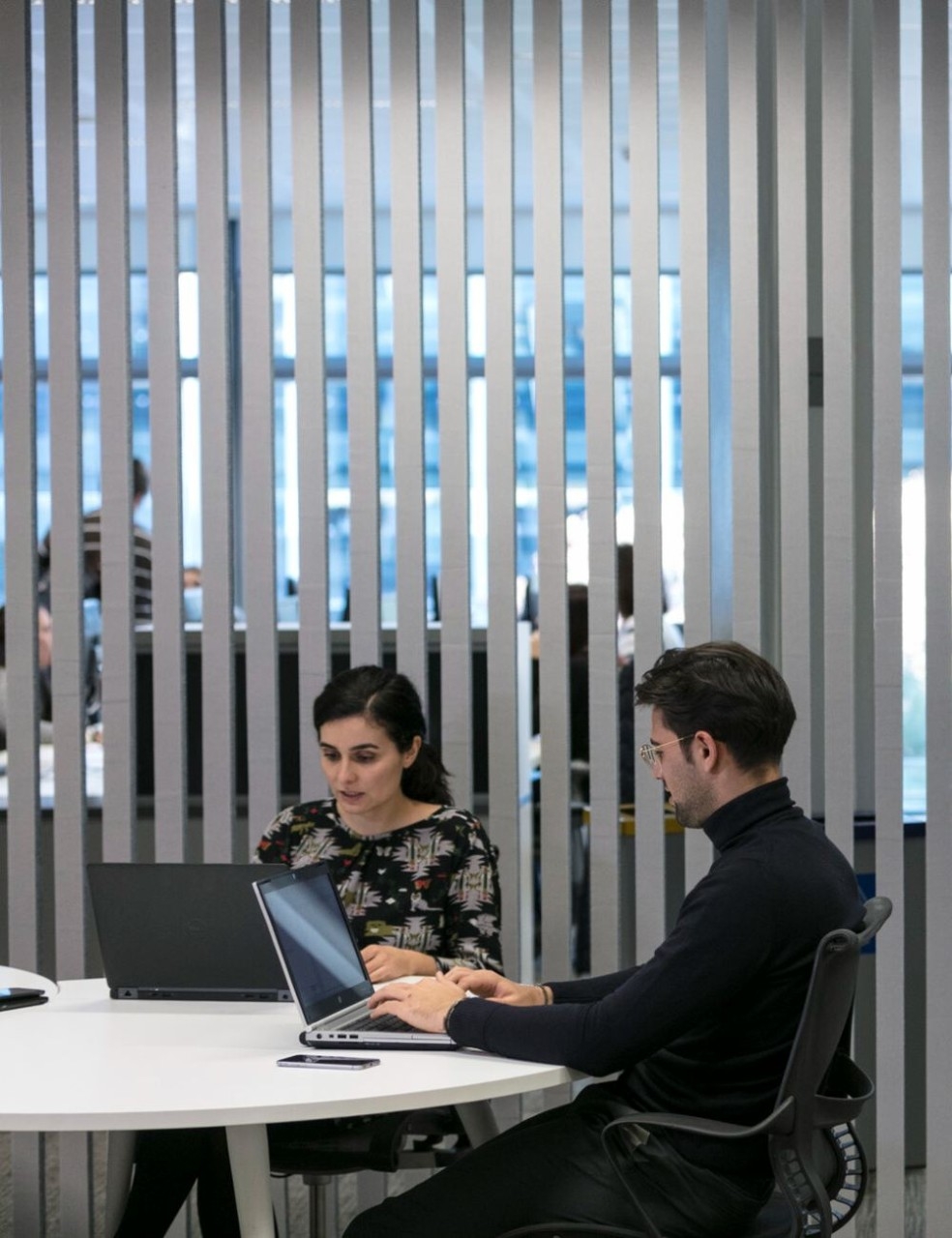 Employees working with computers in office